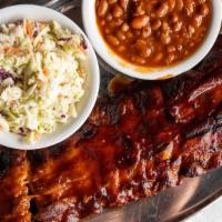 Baby Back Pork Ribs · The prime of the pork ribs, served in our house barbecue sauce. Served with hot cornbread an...