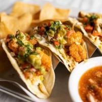 Fried Shrimp Tacos · Jumbo shrimp panko fried, citrus slaw, avocado salsa, cilantro crema, pico de gallo, flour o...