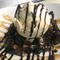 Rockslide Brownie · Fresh baked fudge brownie, caramel, pecans, vanilla ice cream