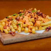 Bacon & Cheese Fries · Gourmet, savory fries smothered with crispy bacon pieces and melted cheese.