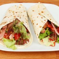 Classic Angus Wrap · Warm, toasted pita wrap filled with a juicy, Angus beef patty, fresh lettuce, roma tomatoes,...