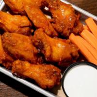 Buffalo Wings · medium spiced wings served with carrots + ranch