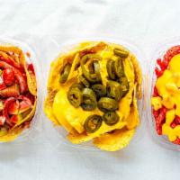 Nachos · Nacho chips covered with nacho cheese and jalapenos.