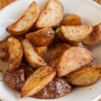 Patate Novelle · Oven roasted new potatoes, crushed chili flakes, rosemary~thyme oil.