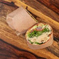 Hummus Dream Wrap · Vegan. A sun-dried tomato wrap packed with spring mixed greens, hummus, tomato, red onion, a...