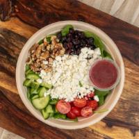 Black Goat Salad · Baby spinach, crumbled goat cheese, cherry tomato, dried cranberries chopped walnuts & a bla...