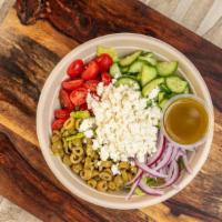 Greek Salad · Vegan. Romaine lettuce, cherry tomato, cucumber, red onion, green olives, and crumbled feta ...