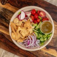 Fatoush Salad · Vegan. Romaine lettuce, cherry tomato, red onion, radish, cucumber, pita chips & a lemon gar...