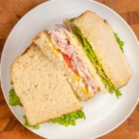 Turkey Breast Sandwich · Thin sliced fresh Turkey Breast, fresh lettuce, ripe tomato, mustard & mayo.