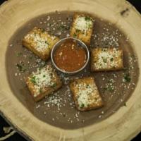 Polenta Toasts  · hard polenta, marinara sauce, parmesan cheese, parsley