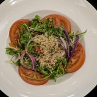 Quinoa Salad · Arugula, quinoa, tomatoes, red onions, bell pepper, cilantro lime dressing. Add choice of si...