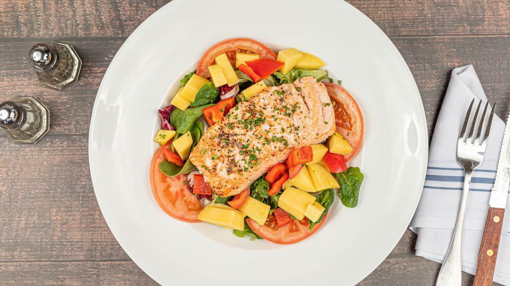 Salmon Salad · Mixed greens lettuce, sautéed salmon, mango, bell pepper, cucumber, tomatoes, honey lime dressing. Add choice of sides and beverages for an additional charge.