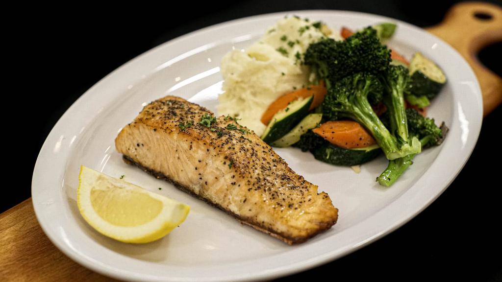 Salmon · Sautéed salmon fillet, sautéed vegetables, garlic mashed potatoes. Add choice of sides and beverages for an additional charge.