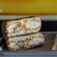 Nashville Hot Grilled Cheese · Our Basic 5 Grilled Cheese with Buffalo Chicken Tenders, Coleslaw, and diced Pickles.