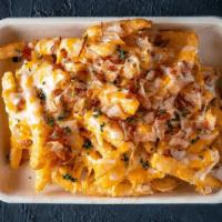 Country Fries · Our Pommes Frites topped with Applewood Bacon, Cheese, and Garnished with fresh Chives with ...