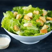 Caesar Salad · Classic Caesar Salad made with Romaine Lettuce, Parmesan Cheese, and Seasoned Croutons. Orig...