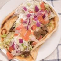Gyro Sandwich · Made on a warm pita with lettuce, tomatoes, onions, and then topped with tzatziki sauce!.