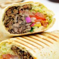 Greek Gyro Wrap · Lamb , Beef or Chicken , Cucumber Sauce , lettuce , tomato , cucumber, and onion