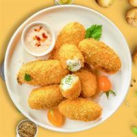 Caliente Poppers · (Vegetarian) Fresh jalapenos coated in mixed Mexican cheese and fried until golden brown.