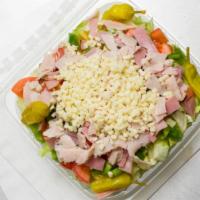 Antipasto Salad · Fresh greens loaded with Mozzarella, salami, ham, artichoke hearts, tomatoes, olives, red on...