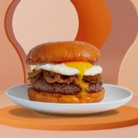 Breakfast Burger · Fried egg with beef burger, caramelized onions and melted cheese.