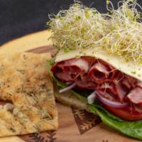 Pastrami · Focaccia bread, pastrami, romain lettuce, alfalfa sprouts, tomato, red onion, pickled radish...