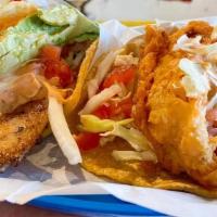 Baja Taco · BATTERED FISH, CABBAGE, CILANTRO, TOMATO, ONIONS, CHIPOTLE SALSA