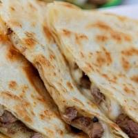 Carne Asada Quesadilla · ON FLOUR TORTILLA WITH GRILLED ANGUS STEAK AND SIDES OF GUACAMOLE, SOUR CREAM, AND PICO DE G...