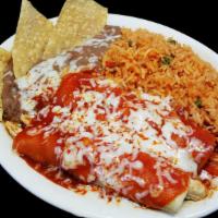 #17   Two Chicken Enchiladas. · Served with two sides of your choice.