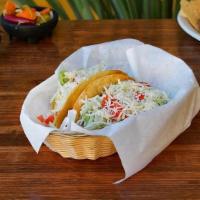 Hard Shell Beef Taco. · hard shell taco with shredded beef, lettuce, tomato, cheese