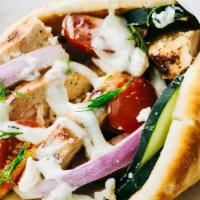 Chicken Gyro Wrap · White meat chicken, romaine, tomato, pickled red onions, Persian cucumbers, greek pita, hous...