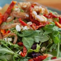 Arugula And Caramelized Onion Salad · Gluten free. Vegetarian. Mixed greens, arugula, caramelized onions, walnuts, blue cheese, su...