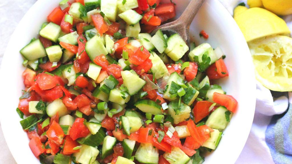Shirazi Salad · Gluten free. Vegetarian. Chopped cucumbers, tomatoes and our house vinaigrette dressing. Gluten free.