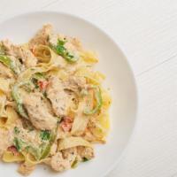 Cajun Chicken And Shrimp Pasta · Delicious pasta made with sautéed chicken, shrimp and red bell peppers tossed with fettuccin...