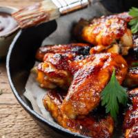 Bbq Wings · Juicy chicken wings deep-fried and smothered in barbecue sauce.