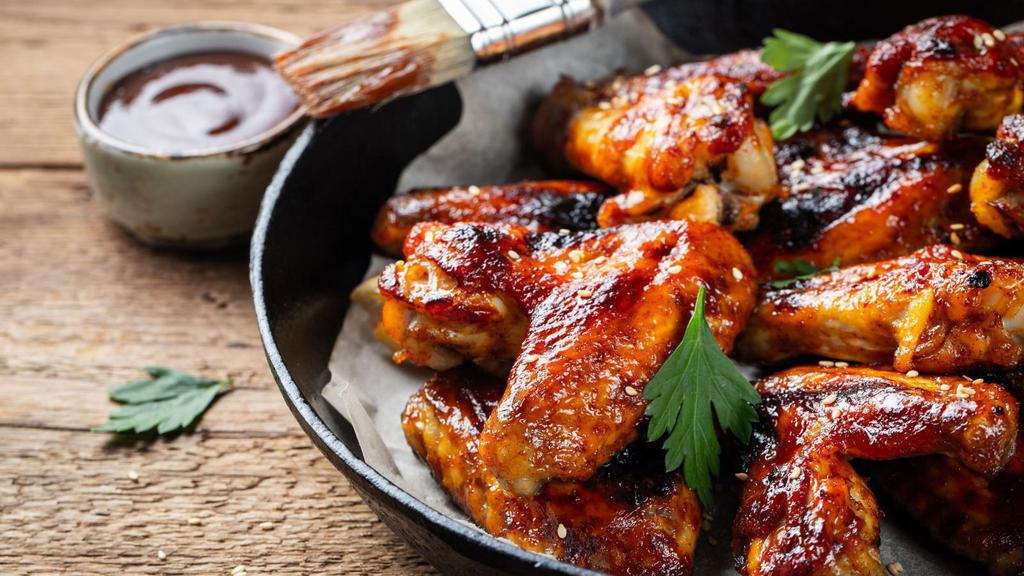 Bbq Wings · Juicy chicken wings deep-fried and smothered in barbecue sauce.