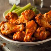 Buffalo Wings · Juicy chicken wings deep-fried and smothered in a tangy buffalo sauce.