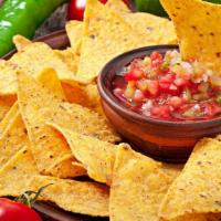 Salsa And Chips · Crispy tortilla chips served with fresh guacamole and chunky salsa.