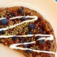 Almond Butter Toast · Toasted sourdough, almond butter, local berry preserves, blueberries, coconut yogurt drizzle...