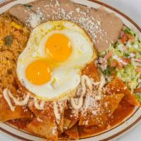 Chilaquiles  Con Huevo · Fried tortilla chips with your choice of Green or Red salsa, cotija cheese, and sour cream t...
