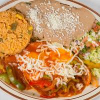 Plato Huevos Rancheros · Two eggs over medium ranchero sauce bell pepper, onions, Fried corn tortilla, and cheese on ...