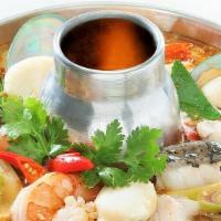 Seafood Soup · Spicy and sour soup with fish, shrimps, mussels, squid, tomatoes, mushrooms, with a touch of...