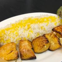 Salmon Kebab · Plates include white rice, barbecued tomato and pepper. Marinated and charbroiled fresh file...