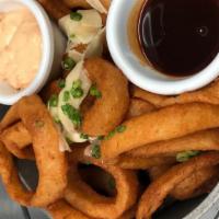 Kettle Of Rings · Signature dish, vegetarian. Sweet yellow onions, beer-battered and fried, garnished with gre...