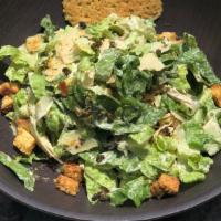 Caesar Salad · Crisp romaine lettuce tossed with Caesar dressing, shaved Parmesan cheese, fried capers and ...