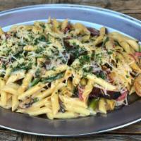 Bayou Cajun Pasta · Penne pasta sauteed with blackened chicken breast, smoked sausage, asparagus, mushrooms, bel...