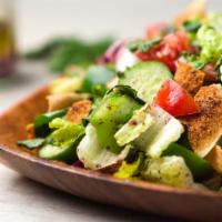 Fattouche Salad · Romaine lettuce, tomato, radish, green pepper, green onion, cucumber, lemon, sumac, and spri...