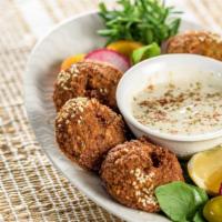 Falafel Plate · Crispy falafels served  with warm pita bread, choice of rice or house salad, choice of two  ...
