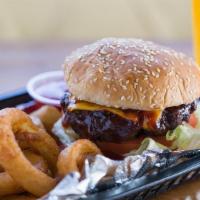 Bourbon Street Burger · Cheddar, lettuce, tomatoes, pickles, onions, and bourbon bbq sauce. Served with fries.