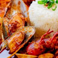 Cajun Seafood With Rice · Crawfish, shrimp, clams, mussels, and cajun sauce. Served with steamed rice.